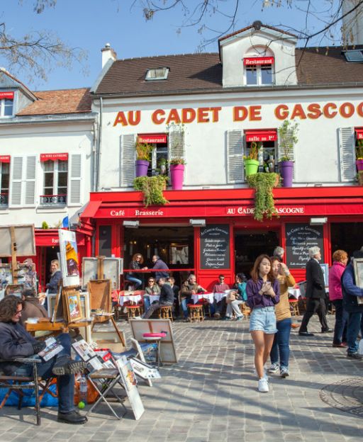 Lively café terrace and street scene at Place du Tertre, Montmartre, Paris