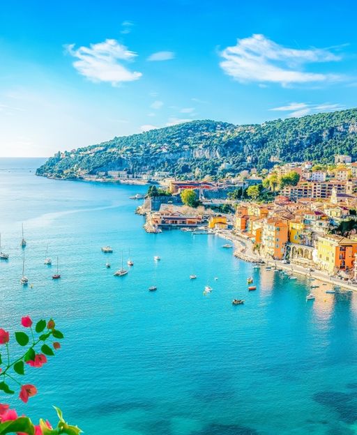Villefranche-sur-Mer bay on the French Riviera with turquoise water, colourful buildings and sailboats