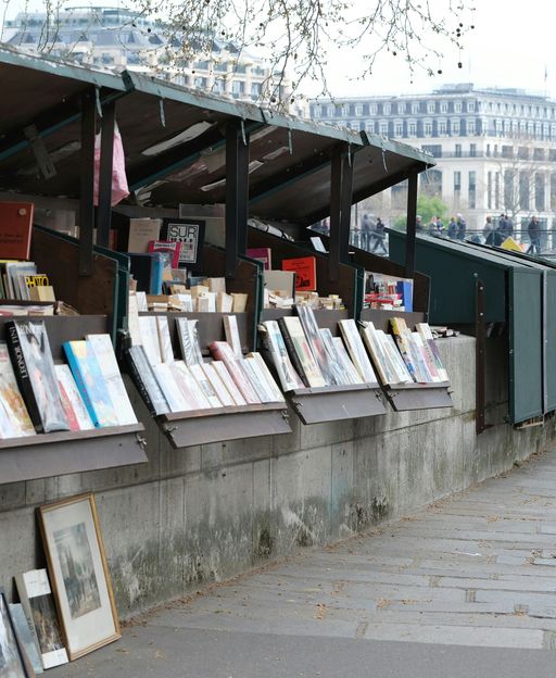 Green bouquiniste book stalls lining the Seine riverbank in Paris