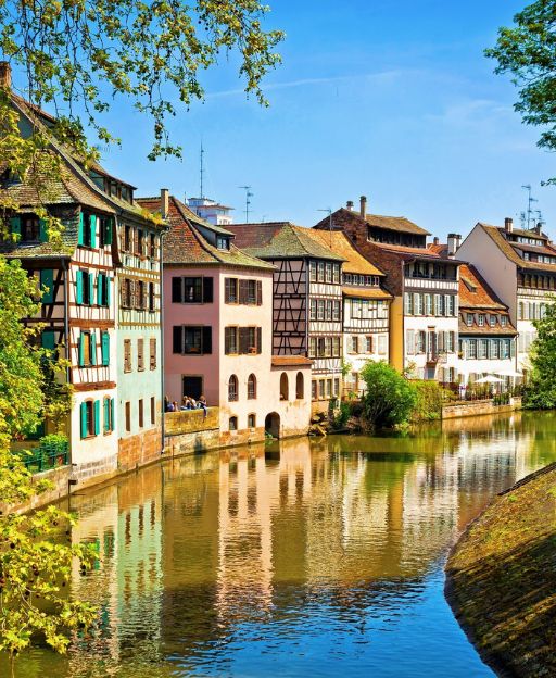 Petite France quarter in Strasbourg, Alsace — half-timbered colombage houses reflected in the Ill River canal