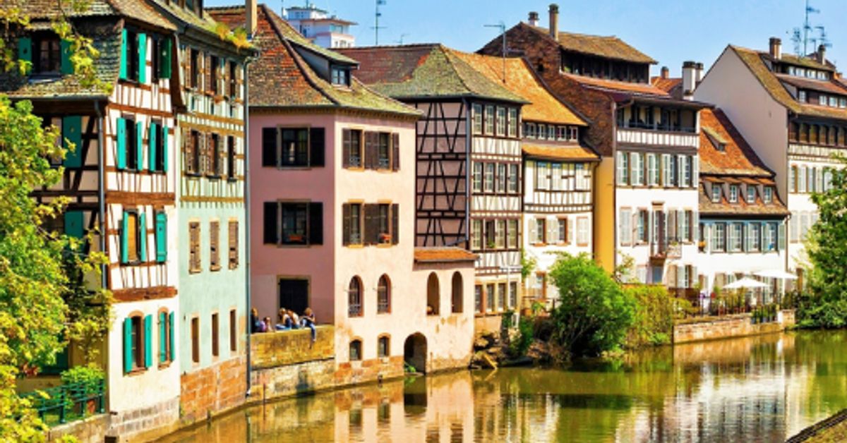 Petite France quarter in Strasbourg, Alsace — half-timbered colombage houses reflected in the Ill River canal