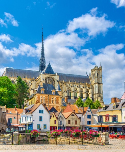 Amiens Cathedral rising above the colourful medieval houses of the Saint-Leu quarter, Picardy, France