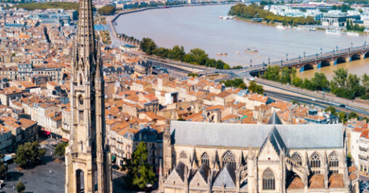 Aerial view of Bordeaux city with Saint-André Cathedral and the Garonne River, France