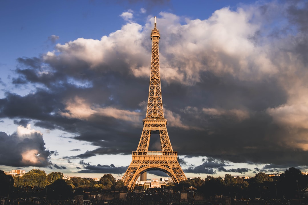 The Eiffel Tower at golden hour, Paris, with a warm amber sky