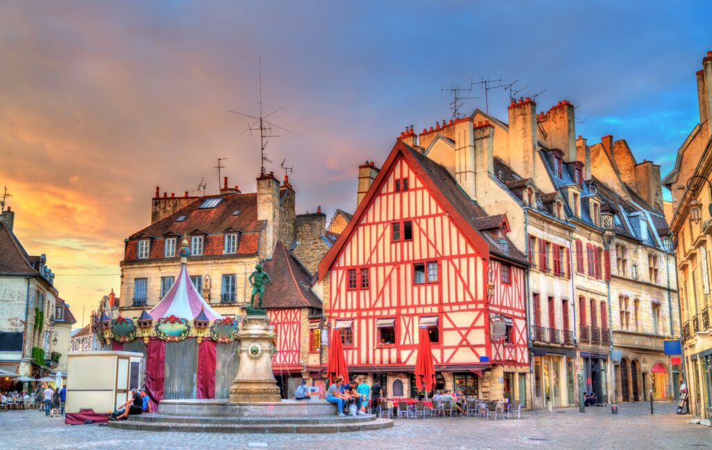Half-timbered houses and a carousel on Place François Rude in Dijon