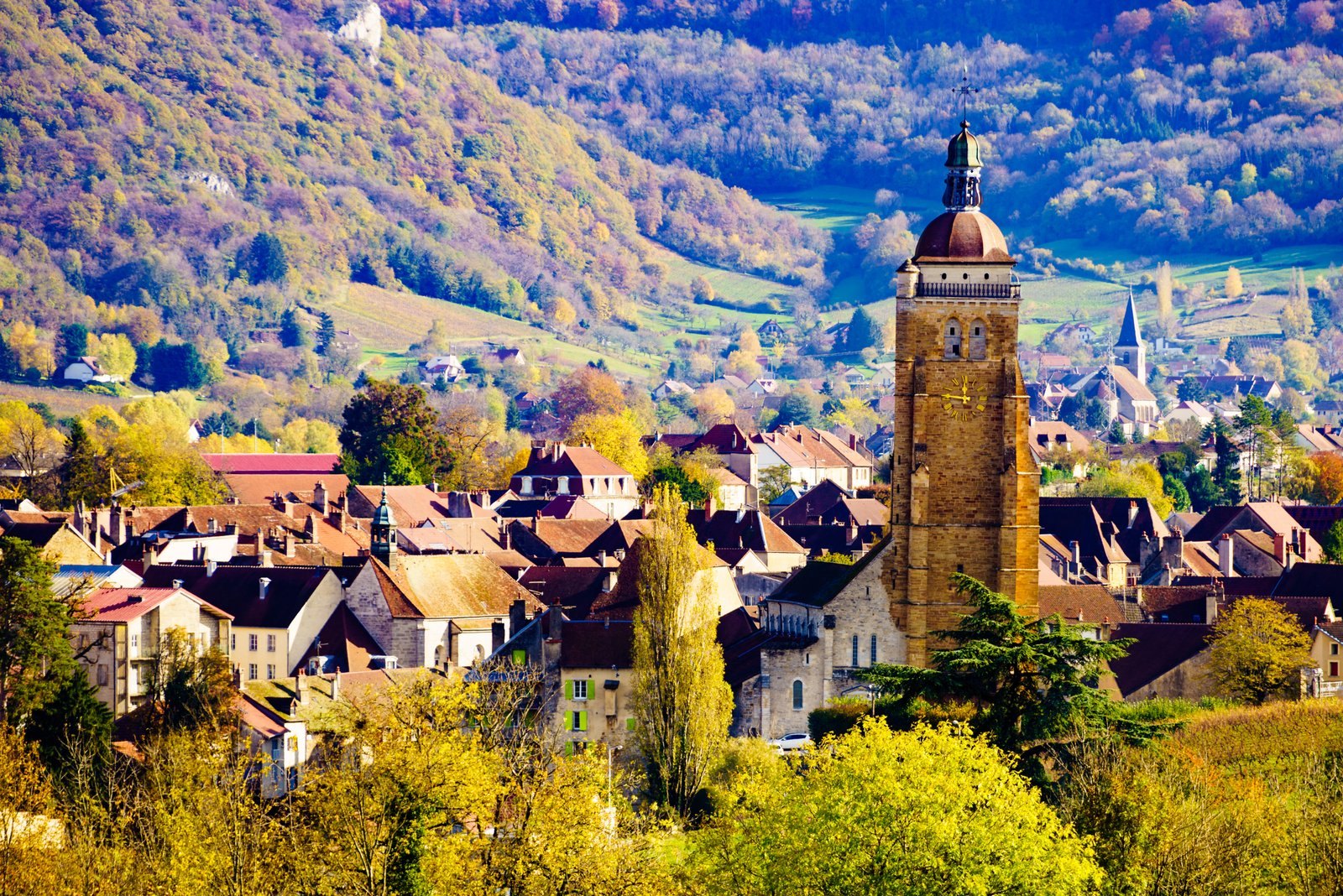 Arbois in the Jura, with the bell tower of Saint-Just church above the town