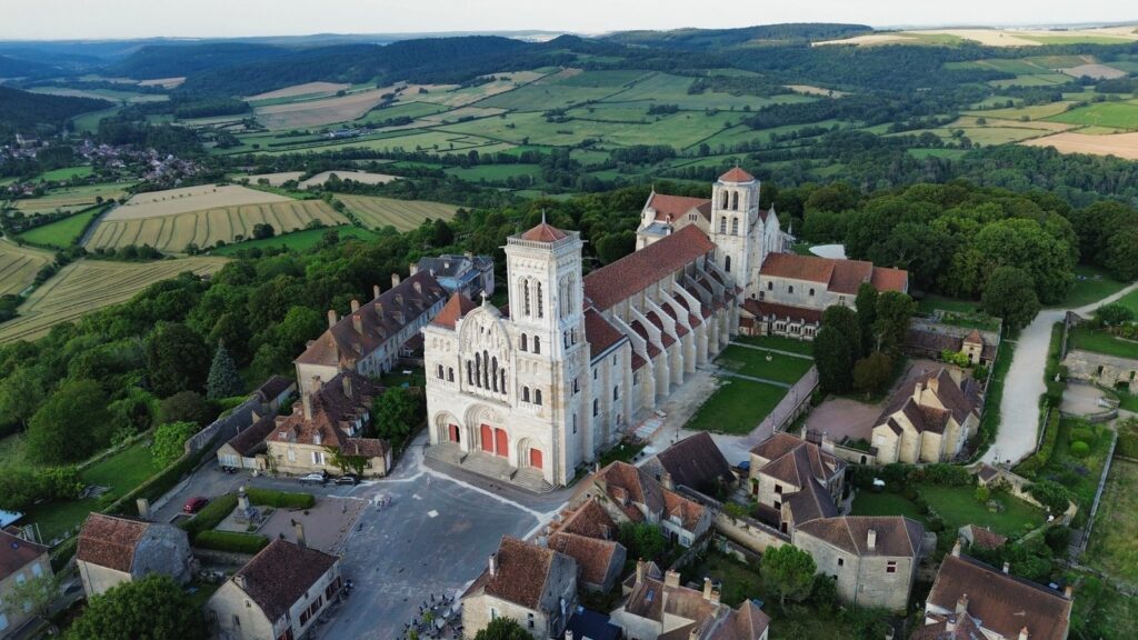 The Basilica of Sainte-Marie-Madeleine above the village of VĂŠzelay, seen from the air