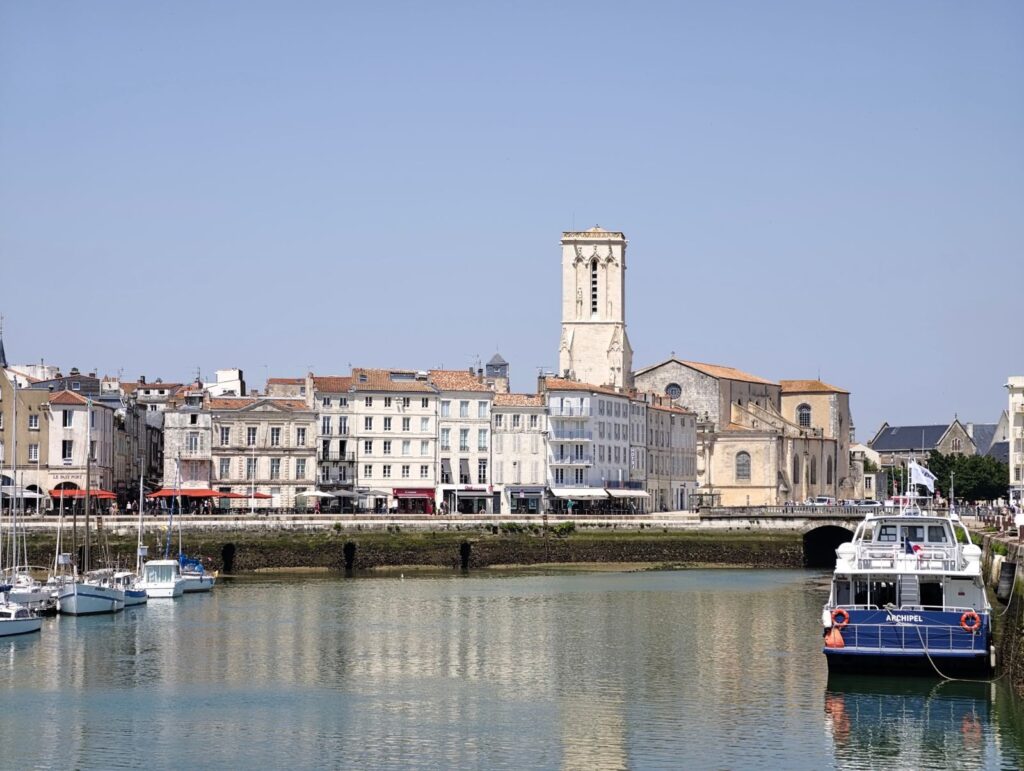 Harbourside houses and a church tower in La Rochelle's old town