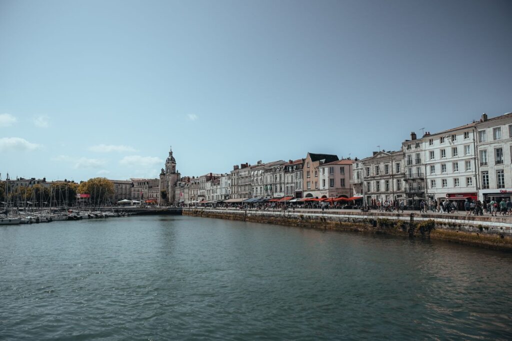 Quayside houses and the Grosse Horloge gate along La Rochelle's old harbour