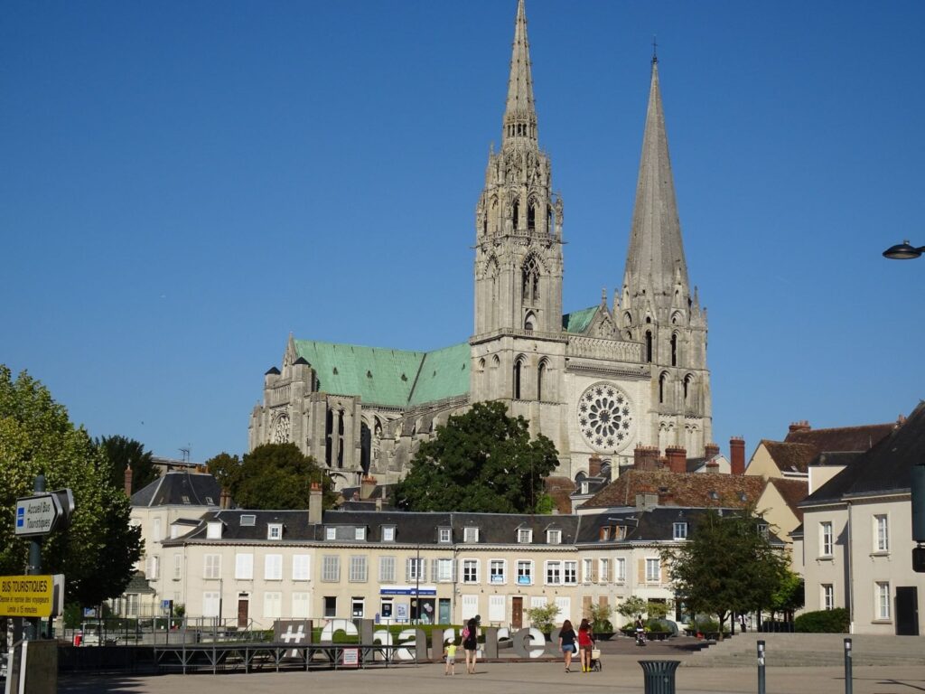 Chartres Cathedral with its two different spires above the town square