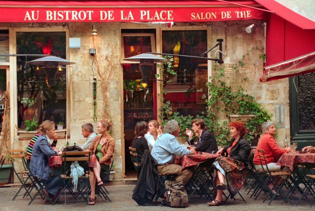 Friends talking at Au Bistrot de la Place, Paris