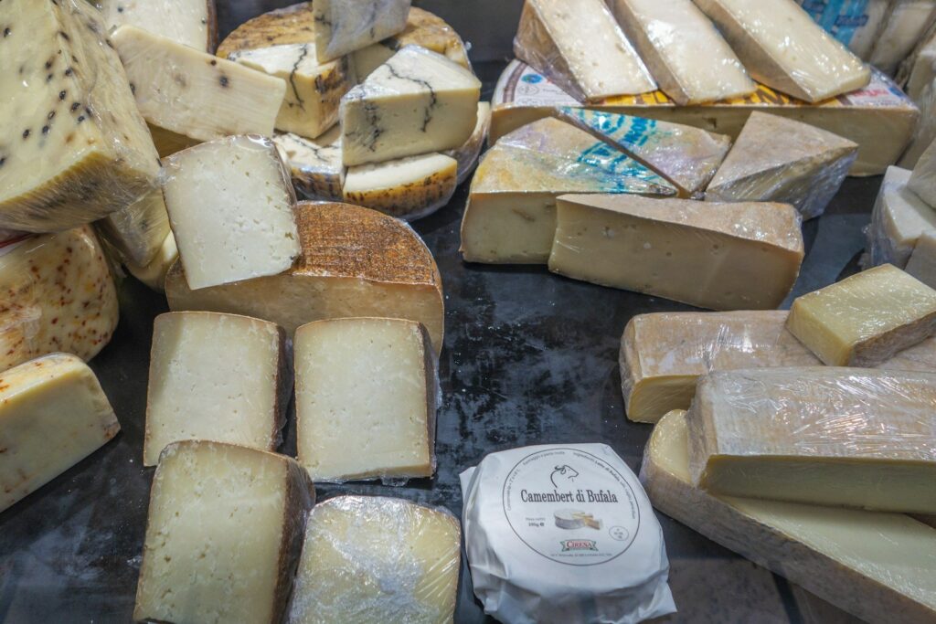 Cheeses in the window of a cheese counter at Les Halles Paul Bocuse, Lyon