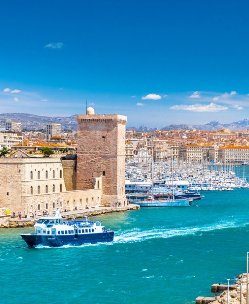Fort Saint-Jean guarding the entrance to the Old Port in Marseille, with boats and the city behind